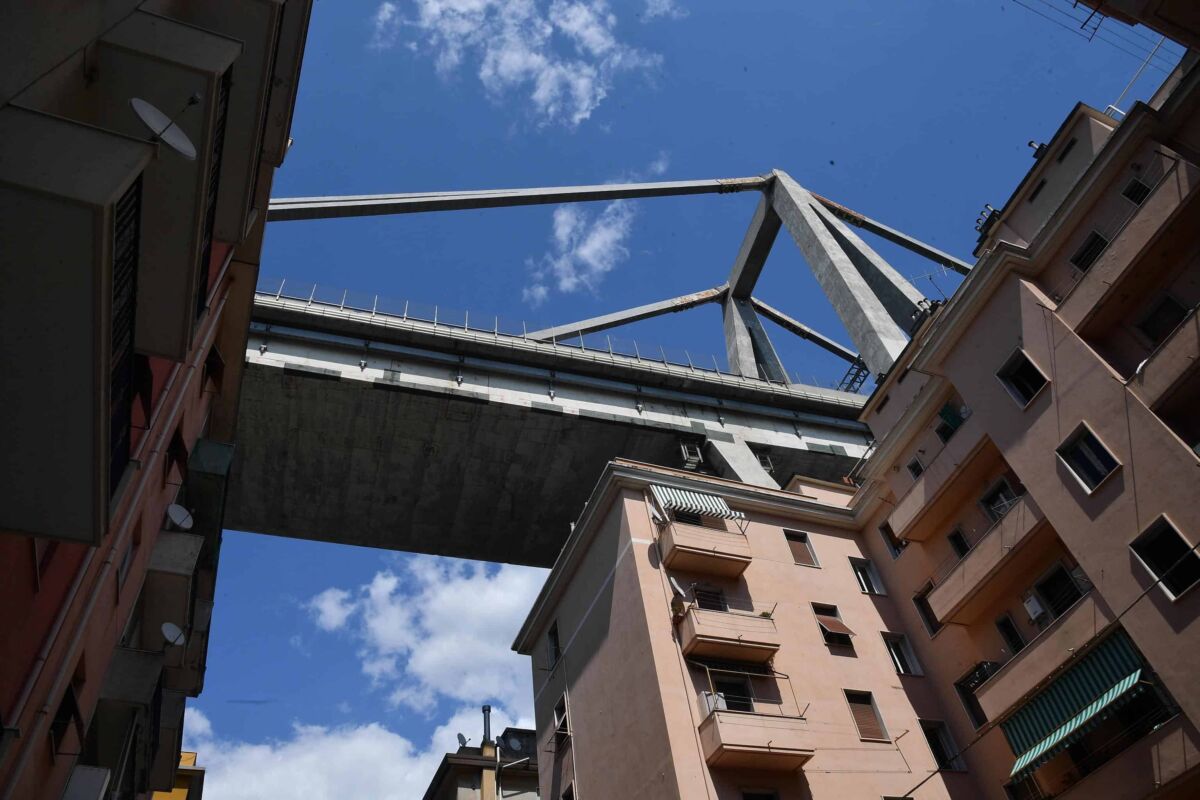 Nearby buildings of the partially collapsed Morandi bridge in Genoa, Italy, 16 August 2018. Italian authorities, worried about the stability of remaining large sections of the bridge, evacuated about 630 people from nearby apartments. The Genoa prefect's office on Thursday corrected the death toll, saying 38 people are known to have died, not 39 as previously reported. The death toll remains provisional.  
ANSA/LUCA ZENNARO