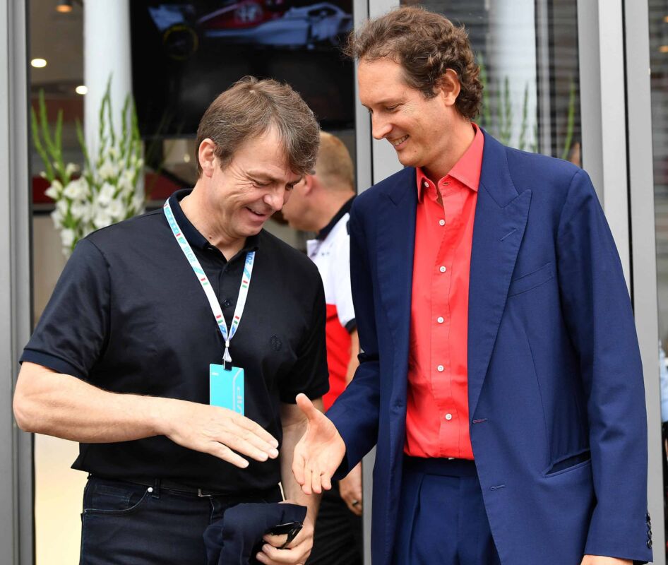 FCA group president John Elkann (R) shakes hand with FAC group Michael Manley, at paddock prior to the start of the Formula One Italy Grand Prix at the Monza racetrack, Italy,2 September 2018.ANSA/DANIEL DAL ZENNARO