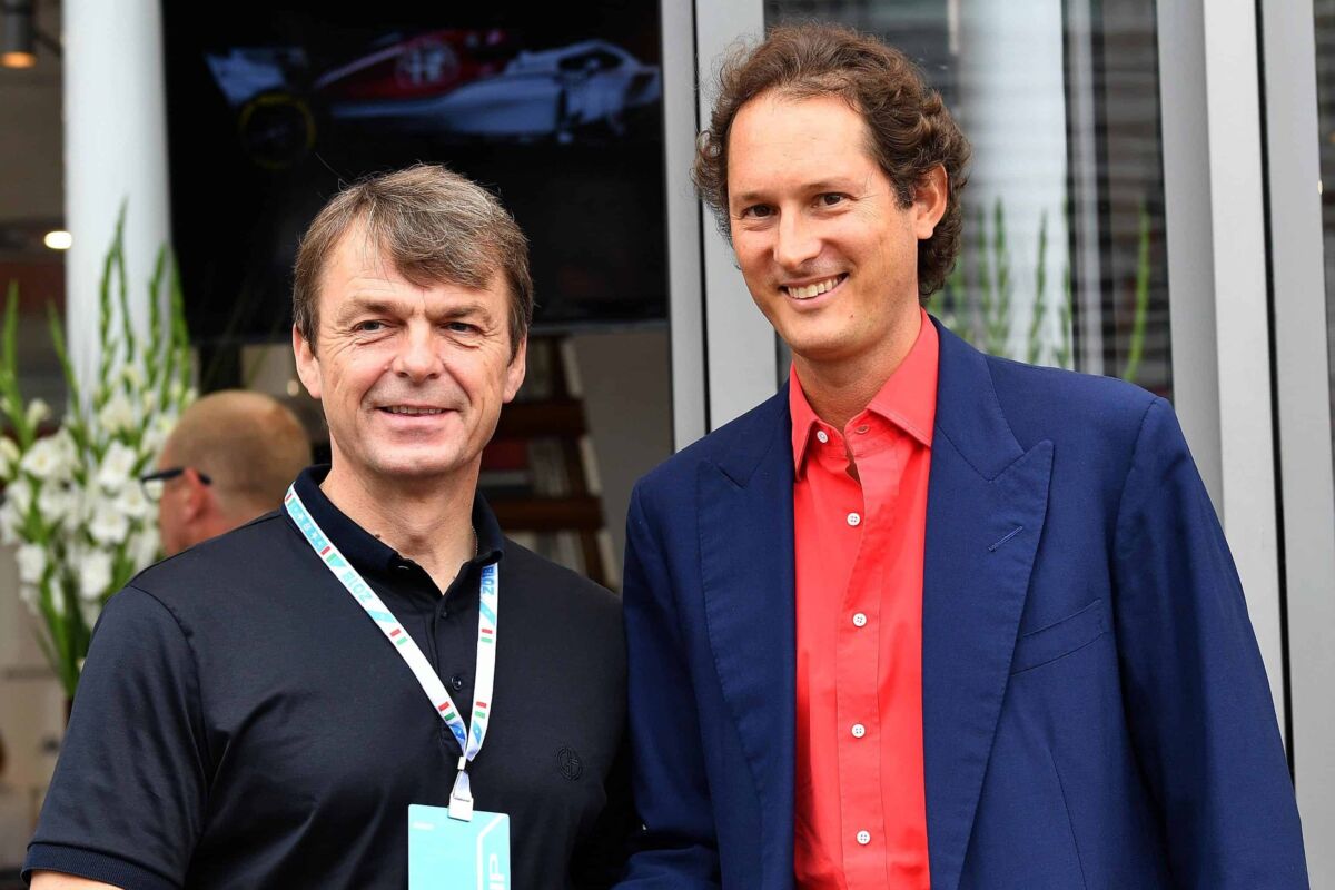 FCA group president John Elkann (R) shakes hand with FAC group Michael Manley, at paddock prior to the start of the Formula One Italy Grand Prix at the Monza racetrack, Italy,2 September 2018.ANSA/DANIEL DAL ZENNARO