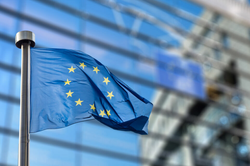 European,Union,Flag,In,Front,Of,The,Berlaymont,Building,(european