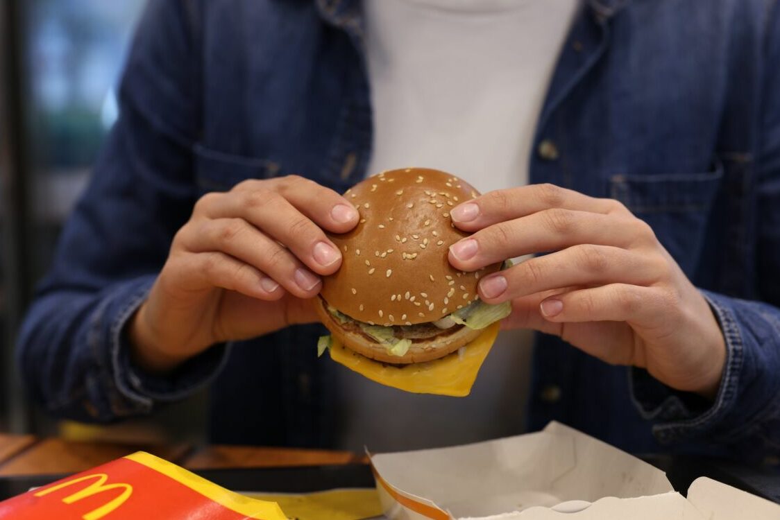 Lviv,,Ukraine,-,October,9,,2023:,Woman,With,Mcdonald's,Burger