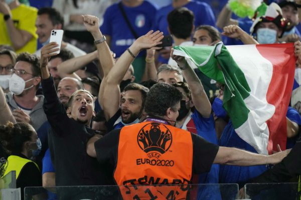 epa09263539 Supporters of Italy celebrate after the UEFA EURO 2020 group A preliminary round soccer match between Turkey and Italy at the Olympic Stadium in Rome, Italy, 11 June 2021.  EPA/Alessandra Tarantino / POOL (RESTRICTIONS: For editorial news reporting purposes only. Images must appear as still images and must not emulate match action video footage. Photographs published in online publications shall have an interval of at least 20 seconds between the posting.)