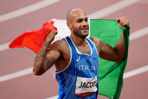 epa09385792 Lamont Marcell Jacobs of Italy celebrates after winning the Men's 100m final during the Athletics events of the Tokyo 2020 Olympic Games at the Olympic Stadium in Tokyo, Japan, 01 August 2021.  EPA/JOE GIDDENS  AUSTRALIA AND NEW ZEALAND OUT