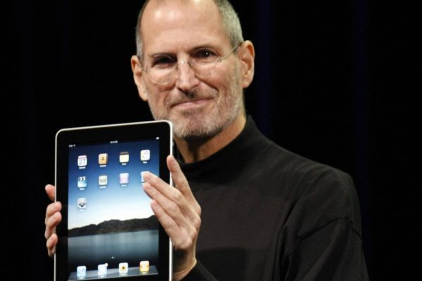 Apple CEO Steve Jobs shows off the new iPad during an event in San Francisco, Wednesday, Jan. 27, 2010. (AP Photo/Paul Sakuma)