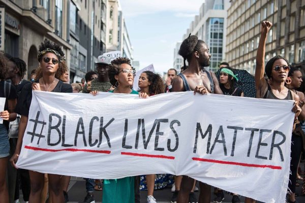 Demonstrators held a banner with the motto of the black civil rights movement with the twitter hashtag "Black Lives Matter" to show their solidarity worldwide with African Americans in the US in Berlin, Germany, 10 July 2016. In the US, there were nationwide protests after the death of two African American by police shots. On the night of Friday 07 July 2016 the situation escalated. A sniper shot dead five police and injured two civilians during a demonstration against police violence in Dallas, Texas. Photo by: Wolfram Kastl/picture-alliance/dpa/AP Images