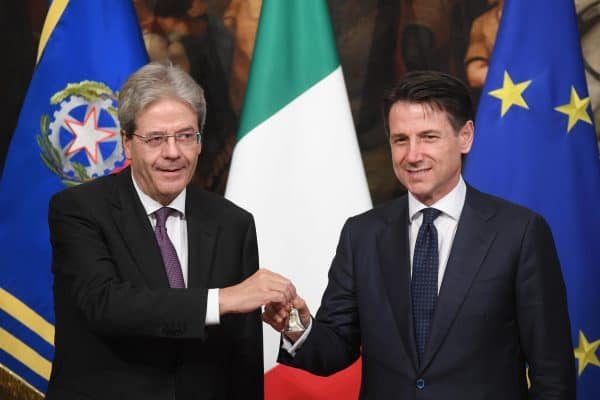 Newly appointed Italian Prime Minister Giuseppe Conte (right) receives from the outgoing Prime Minister Paolo Gentiloni (left) the small silver bell to open the First Council of Minister at Chigi Palace in Rome, 1 Jun 2018. ANSA/CLAUDIO PERI