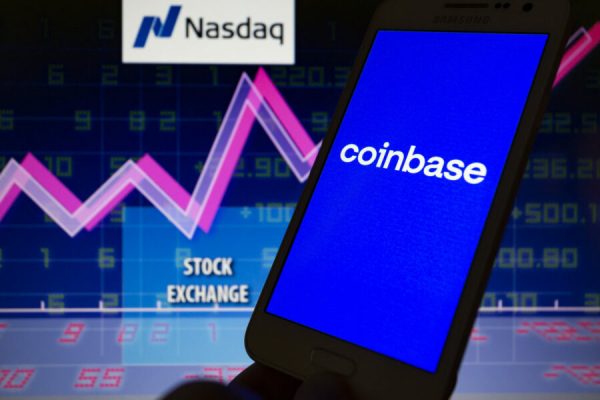 April 13, 2021, Asuncion, Paraguay: Illustration photo - Logo of Coinbase, a cryptocurrency trading platform, is displayed on a smartphone backdropped by Nasdaq logo, the words stock exchange, abstract presentation of line chart and numbers on screen. Coinbase anticipates that its Class A common stock will begin trading on the Nasdaq Global Select Market under the ticker symbol ''COIN'' on April 14, 2021. (Credit Image: © Andre M. Chang/ZUMA Wire)