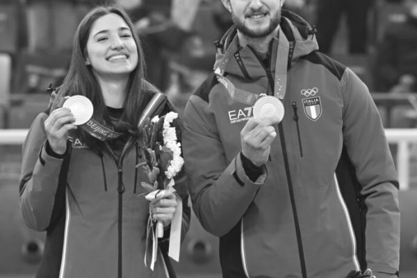 (220208) -- BEIJING, Feb. 8, 2022 (Xinhua) -- Gold medalists Stefania Constantini (L) and Amos Mosaner of Italy attend the awarding ceremony of the curling mixed doubles event of the Beijing 2022 Winter Olympics at the National Aquatics Centre in Beijing, capital of China, Feb. 8, 2022. (Xinhua/Li He)