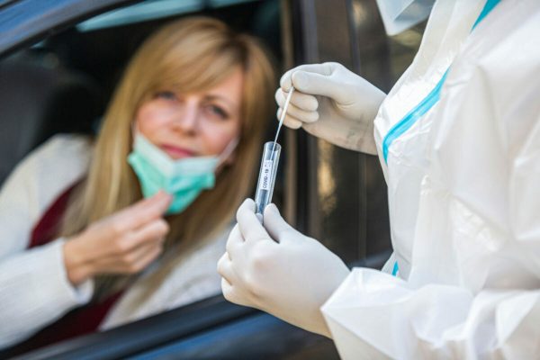 Woman,Sitting,In,Car,,Waiting,For,Medical,Worker,To,Perform