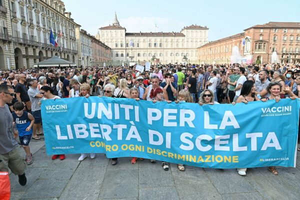 A moment of a manifestation against the Green Pass in Turin, Italy, 24 July 2021.   ANSA/ALESSANDRO DI MARCO
