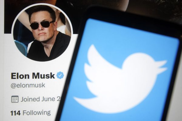 April 26, 2022, Ukraine: In this photo illustration, Twitter logo is seen on a smartphone screen and Elon Musk Twitter webpage in the background. Elon Musk reaches deal to buy Twitter Inc for $44 billion, reportedly by media. (Credit Image: © Pavlo Gonchar/SOPA Images via ZUMA Press Wire)