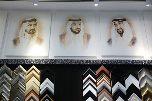 epa09945317 Portraits of (L-R) Sheikh Mohammed bin Rashid al Maktoum, late United Arab Emirates President Sheikh Khalifa bin Zayed Al Nahyan, Sheikh Mohammed bin Zayed Al Nahyan displayed at a shop in Dubai, UAE, 13 May 2022. Sheikh Khalifa died on 13 May at the age of 73.  EPA/ALI HAIDER