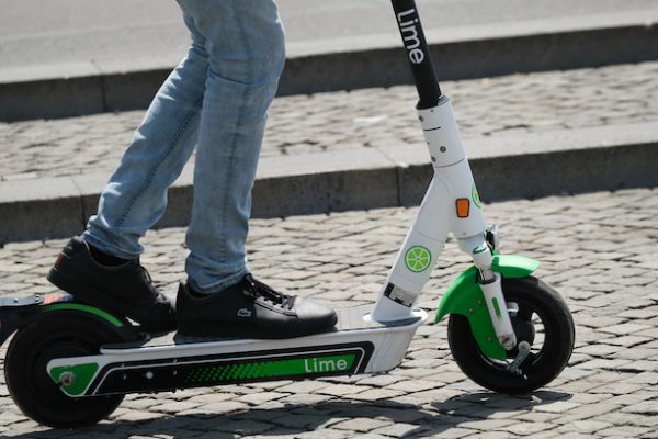 BERLIN, GERMANY - JUNE 25: A man rides a Lime electric scooter in the city center on June 25, 2019 in Berlin, Germany. Lime launched its scooter service in Berlin last week following the recent legalization of their use by the German government.  (Photo by Sean Gallup/Getty Images)