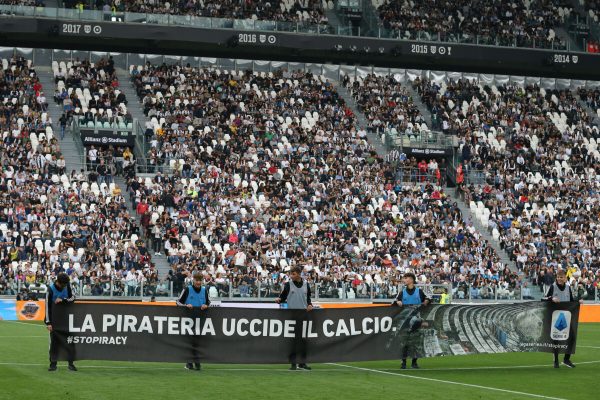 September 21, 2019, Turin, United Kingdom: Ballboys hold a banner saying Piracy kills football, a campaign by the Serie A against illegal streaming of matches during the Serie A match at Allianz Stadium, Turin. Picture date: 21st September 2019. Picture credit should read: Jonathan Moscrop/Sportimage(Credit Image: © Jonathan Moscrop/CSM via ZUMA Wire)