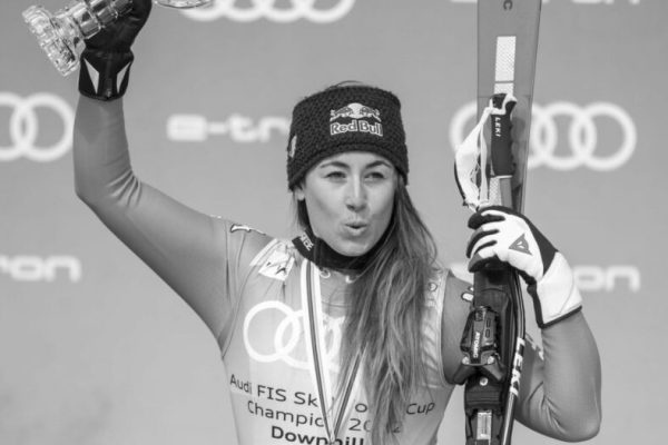 epa09828632 Sofia Goggia of Italy celebrates her crystal globe the allover women's Downhill competiton at the FIS Alpine Skiing World Cup final in Courchevel, France, 16 March 2022.  EPA/URS FLUEELER