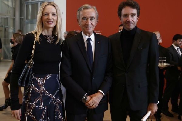 epa09479806 Head of LVMH luxury group, Bernard Arnault  (C), his daughter Delphine Arnault (L) and his son Antoine Arnault (R) attend the exhibition 'The Morozov Collection, Icons of Modern Art' at Fondation Louis Vuitton in Paris, France, 21 September 2021.  EPA/YOAN VALAT / POOL