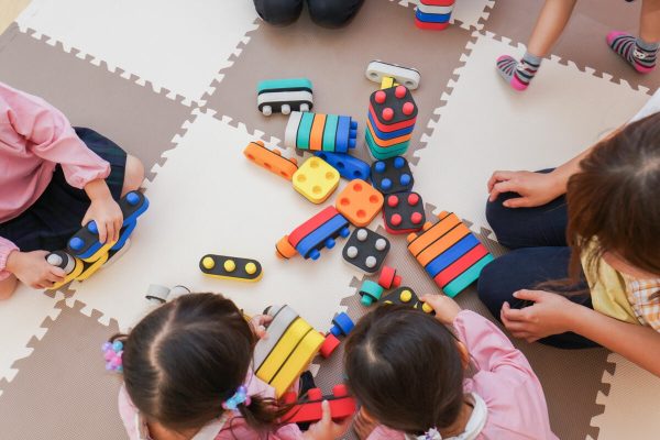 Children,Playing,At,Nursery,School