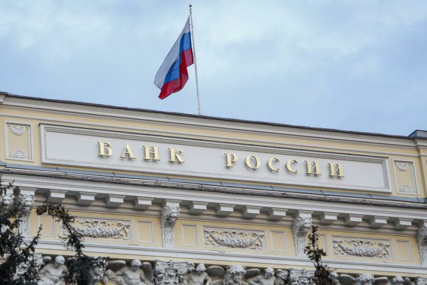 epa09791191 The Russian National flag waves atop the Bank of Russia headquarters in Moscow, Russia, 28 February 2022. The Bank of Russia decided to raise the key rate from 9.5 percent to 20 percent per annum starting 28 February. The Central Bank attributed this to a radical change in external conditions. The measure was taken in light of harsh sanctions imposed by the international community on Russia following its troops entering Ukraine on 24 February, and the subsequent collapse of the ruble.  EPA/SERGEI ILNITSKY