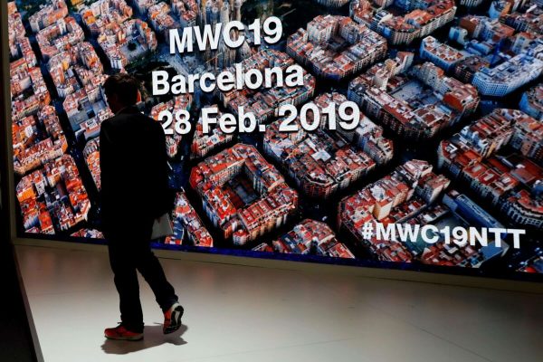 epa07404557 A visitor walks pass the Xiamo stand at the Mobile World Congress (MWC19) in Barcelona, Spain, 28 February 2019. The latest developments in mobile technologies are presented at the MWC19 from 25 to 28 February.  EPA/TONI ALBIR