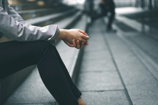 Close-up,Hands,Of,Businesswoman,Stressed,From,Work,While,Sitting,Outdoors