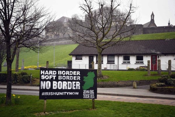 epa07447782 (21/28) An Anti-Brexit sign is displayed in the Republican area of the Bogside, a neighborhood outside the city walls, in Londonderry in Northern Ireland, Britain, 28 February 2019. In 1969 a battle against the RUC and local Protestants known as the 'Battle of the Bogside' became a starting point of the Troubles.  On maps of Ireland, a line cuts across the north of the island like a scar, dividing Northern Ireland from the larger Republic of Ireland. That line is both physical and symbolic, signaling the geographic separation of two countries as well as their historical, social and religious differences. The reality of the Irish border is complex. Today, it is no longer a âhardâ border, though crossings are littered with rusting customs posts from another time. Often a change in road markings or the color of the tarmac are the only indicators that you have crossed into another country. It is possible to drive along a road and cross the border two or three times without even knowing it.
The border, which stretches 499 kilometers (310 miles), was established in 1921 by the Anglo-Irish Treaty whereby 26 Catholic counties were granted autonomous status as the Republic of Ireland and six northern counties, inhabited mostly by Protestants loyal to the British monarchy, remained within the UK as Northern Ireland. The division of the island and the discrimination of the Catholic population in Northern Ireland led to a conflict between republican militias, mostly Catholics calling for union with the rest of the island, and unionist paramilitaries from largely Protestant areas who wanted to remain part of the UK. Decades of political violence, known as The Troubles, which began in the late 1960s and continued until the signing of the Good Friday Agreement in 1998, cost the lives of more than 3,000 people. After the signing of the international peace deal, bloodshed fell considerably, bringing an end to the need for fences and border barriers, and Irish citize