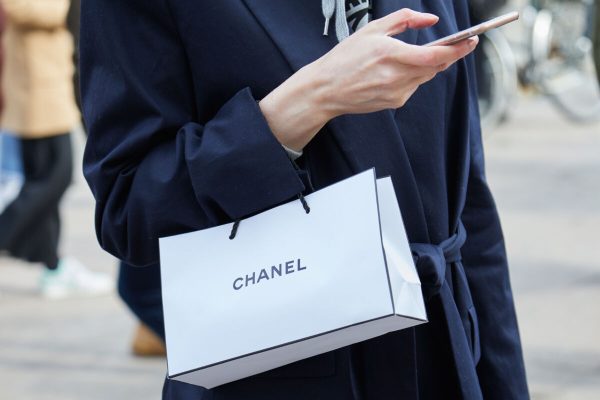 Milan,-,February,22:,Woman,With,Chanel,Shopper,Looking,At