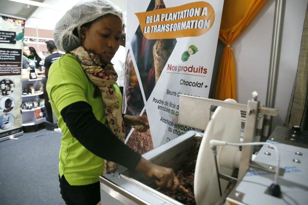 epa10215935 A participant in her stand during the opening ceremony of the 8th edition of Cocoa and Chocolate Day in Abidjan, Ivory Coast, 30 September 2022. Created by presidential decree in 2013, Cocoa and Chocolate Day (JNCC) is celebrated in Ivory Coast at the start of each cocoa campaign, like in Ghana, Cameroon, Nigeria and the Dominican Republic. Cocoa and Chocolate Day thus marks the opening of the main cocoa marketing campaign and, in turn, celebrates coffee and cocoa producers. The farm gate price of cocoa has been set at 900 FCFA (1.37 Euro) and that of coffee at 750 FCFA (1.14 Euro) for the 2022-2023 campaign.  EPA/LEGNAN KOULA