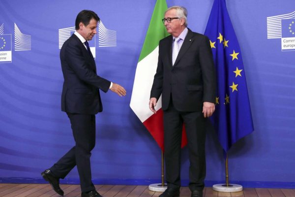 European Commission President Jean-Claude Juncker, right, greets Italian Prime Minister Giuseppe Conte prior to a meeting at EU headquarters in Brussels, Wednesday, Dec. 12, 2018. (Francisco Seco) [CopyrightNotice: Copyright 2018 The Associated Press. All rights reserved.]