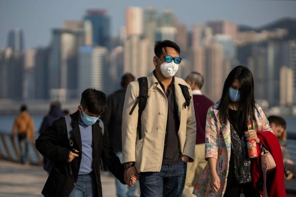 epa08175524 People wear masks on the Tsim Sha Tsui waterfront promenade in Hong Kong, China, 29 January 2020. Hong Kong Health authorities said on 29 January that two more people, an elderly couple from Wuhan, have tested positive for the new coronavirus in Hong Kong. Results from confirmatory tests are still pending, but if they were found to be infected, that would bring the total number of confirmed cases in Hong Kong to ten.  EPA/JEROME FAVRE