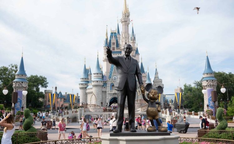 July 15, 2018 - Orlando, FL, USA - The statue of Walt Disney and Mickey Mouse in front of Cinderella Castle located in the Magic Kingdom at Walt Disney World Resort on July 15, 2018 in Orlando, Florida. (Credit Image: © Bryan Smith via ZUMA Wire)