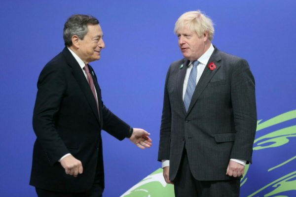 epa09557320 British Prime Minister Boris Johnson (R) greets Italian Prime Minister Mario Draghi (L) as leaders arrive to attend the COP26 UN Climate Change Conference in Glasgow, Britain 01 November 2021. The 2021 United Nations Climate Change Conference (COP26) runs from 31 October to 12 November 2021 in Glasgow.  EPA/ROBERT PERRY