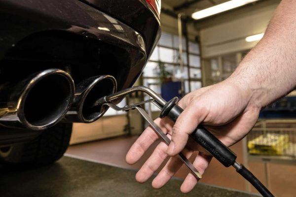 epa07387655 (FILE) - A technician of the German Technical Inspection Association 'TUeV Rheinland' inserts a detector probe into the exhaust pipe of a car at a garage of the organization in Berlin, Germany, 05 January 2018 (reissued 22 February 2019). Illegal emissions-cheating devices built into multiple brands of diesel cars can be considered a defect, ruled Germany's Federal Court of Justice on 22 February. Car emissions - especially of Diesel engine powered vehicles - are still in the focus of environmentalists and politicians after a court decision on the ban of diesel vehicles in polluted inner-city areas.  EPA/TILL RIMMELE