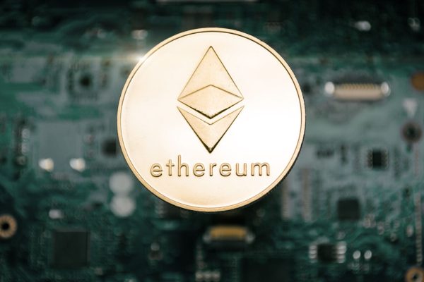 Gold,Cryptocurrency,Coin,-,Etherum,,On,Background,Of,Computer,Motherboard.