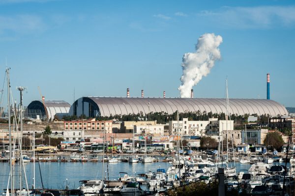 November 29, 2019, Taranto, Italy: A general view of the shelters covering the mineral park at the ArcelorMittal Italia steel plant (ex Ilva) seen past the Tamburi residential district in Taranto, on November 29, 2019. Steel giant ArcelorMittal pulled out of an agreement to buy struggling Italian firm Ilva on November 4, 2019 because of production concerns, cutting 5,000 jobs. (Credit Image: © Manuel Dorati/ZUMA Wire)