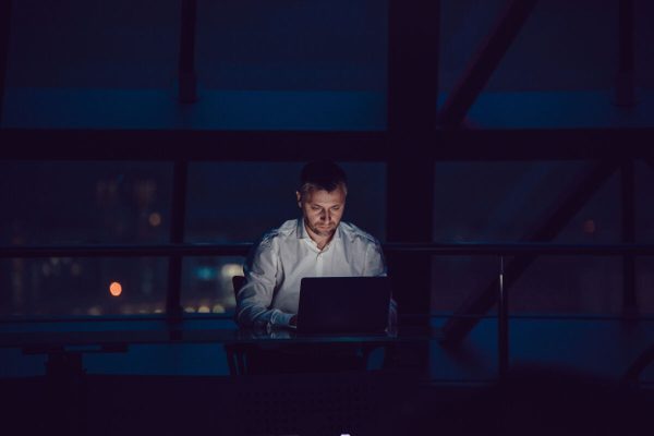 Businessman,Working,On,Laptop,In,Night,Office.