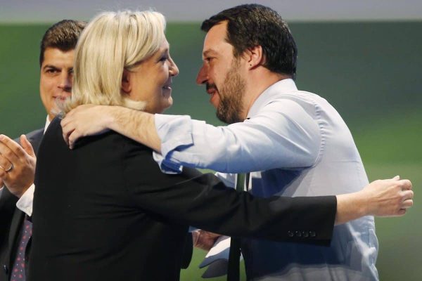 French National Front president Marine Le Pen, left, hugs  Italy's Northern League leader Matteo Salvini during the Europe of Nations and Freedom movement meeting in Milan, Italy, Thursday, Jan. 28, 2016. (ANSA/AP Photo/Antonio Calanni)