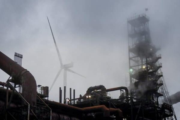 epa06357497 A wind power plant at the company Arcelor Mittal in Hamburg, Germany, 29 November 2017. The company opens three wind power plants on its ground. The turbines should help to cover the energy requirements of the steel production. The wind power plants are able to produce more than 23.000 megawatt hours. The blast furnace exhausted some 830 Giga watt hours energy a year.  EPA/DAVID HECKER