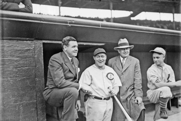 1929 - Chicago, Illinois, U.S. - Informal three-quarter length group portrait of baseball players HACK WILSON of the National League's Chicago Cubs, and BABE RUTH of the American League's New York Yankees, standing in a dugout at Wrigley Field in Chicago, Illinois, before a 1929 World Series game between the Cubs and the American League's Philadelphia Athletics. Ruth is wearing street clothes. An unidentified man wearing street clothes and an unidentified Philadelphia player are standing in the dugout. Wrigley Field is located at 1060 West Addison Street and bounded by West Waveland Avenue, North Seminary Avenue, North Clark Street, and North Sheffield Avenue in the Lake View community area. (Credit Image: © Chicago History Museum/ZUMAPRESS.com)