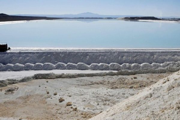 epa03296069 Picture made available on 05 July 2012 showing a truck working at the salt evaporation pools of the Chilean Society of Lithium, at Salar de Atacama desert, one of the major sources for the world's lithium, in Calama, Northern Chile 22 June 2012. Lithium is a key ingredient in energy industry, computing, mobile phone services, electric and electric hybrid cars, and other gadgets we use every day. That's why the world's demand for lithium has been tripled in the last ten years, and according to Chilean Copper Commission (COCHILCO), it's price in the international markets has grown from 2,000 to 6,000 US dollars per ton in the period 2001- 2012  EPA/ARIEL MARINKOVIC