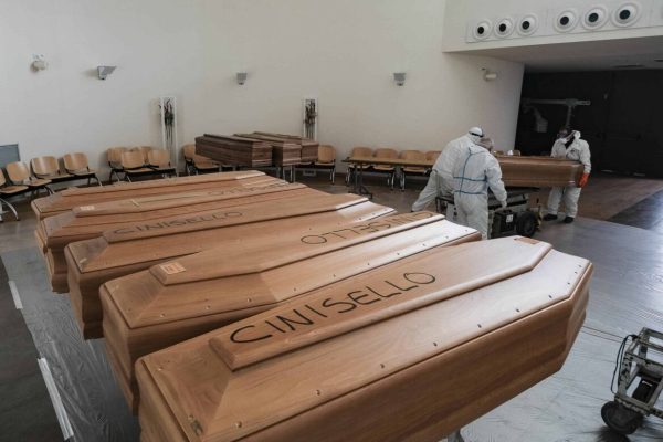 Italian army soldiers wearing protective suits transport coffin on military trucks from the Bergamo area to the cemetery of Cinisello Balsamo, near Milan, Cinisello Balsamo, 27 March 2020. Countries around the world take measures to stem the widespread of the SARS-CoV-2 coronavirus which causes the Covid-19 disease. ANSA/ANDREA FASANI