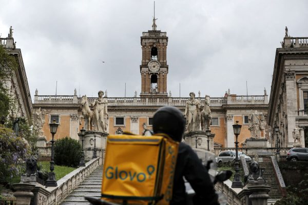 A Glovo rider passes by the Capitol during RomeÕs birthday, Rome, Italy, 21 April 2020. ANSA/RICCARDO ANTIMIANI