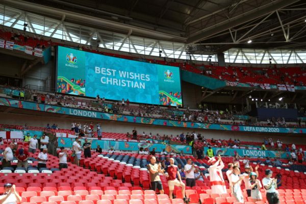 epa09266951 A message reading 'Best Wishes Christian' dedicated to Danish soccer player Christian Eriksen is shown on a huge screen prior to the UEFA EURO 2020 group D preliminary round soccer match between England and Croatia at Wembley stadium in London, Britain, 13 June 2021.  EPA/Carl Recine / POOL (RESTRICTIONS: For editorial news reporting purposes only. Images must appear as still images and must not emulate match action video footage. Photographs published in online publications shall have an interval of at least 20 seconds between the posting.)