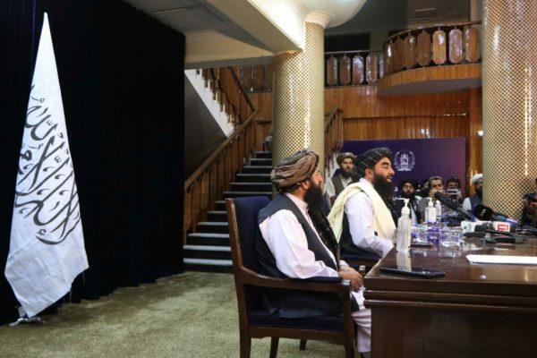 epa09418133 Zabihullah Mujahid, Taliban spokesman talks with journalists during a press conference in Kabul, Afghanistan, 17 August 2021. The new Taliban leadership that swept to power in Afghanistan has said it would not seek revenge against those who had fought against it and would protect the rights of Afghan women within the rules of Sharia law. Mujahid added the Taliban would work to avoid any return to conflict or for Afghanistan to become a hub for terrorism that would threaten other countries in the region.  EPA/STRINGER