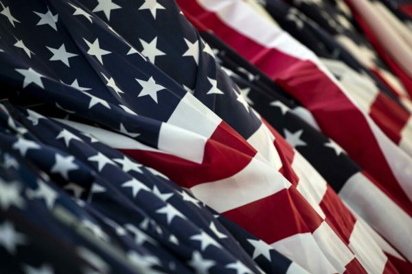 epa09456667 American flags are piled up and ready to be placed as part of a display to commemorate the victims of the 11 September 2001 attacks on US soil, at the Pepperdine University in Malibu, California, USA, 08 September 2021. The display Waves of Flags comprises 2977  American and foreign flags, honoring the lives lost in the terrorist attacks in New York, Pennsylvania and Washington, D.C. Pepperdine stages the display every year in September with nearly 3,000 flags at Alumni Park along Pacific Coast Highway and Malibu Canyon.  EPA/ETIENNE LAURENT