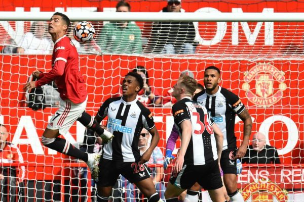 epa09461253 Cristiano Ronaldo of Manchester United (L) wins the header during the English Premier League soccer match between Manchester United and Newcastle United in Manchester, Britain, 11 September 2021.  EPA/PETER POWELL EDITORIAL USE ONLY. No use with unauthorized audio, video, data, fixture lists, club/league logos or 'live' services. Online in-match use limited to 120 images, no video emulation. No use in betting, games or single club/league/player publications