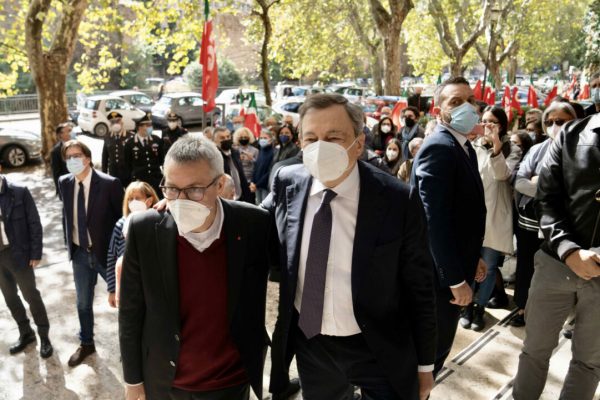 This handout photo provided by the Chigi Palace Press Office shows Italian Prime Minister Mario Draghi (R) flanked by CGIL General Secretary Maurizio Landini (L) as he visits the CGIL Union headquarters which were ransacked last Saturday during the rioting, in Rome, Italy, 11 October 2021. Rome prosecutors have opened two probes into the violence that broke out during Saturday's protest against the Green Pass vaccine passport in the capital.
ANSA/ CHIGI PALACE PRESS OFFICE/ FILIPPO ATTILI
+++ ANSA PROVIDES ACCESS TO THIS HANDOUT PHOTO TO BE USED SOLELY TO ILLUSTRATE NEWS REPORTING OR COMMENTARY ON THE FACTS OR EVENTS DEPICTED IN THIS IMAGE; NO ARCHIVING; NO LICENSING +++