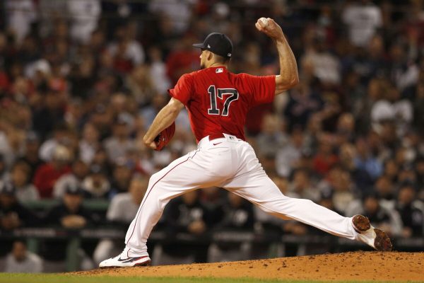 epa09508264 Boston Red Sox starting pitcher Nathan Eovaldi winds up for a pitch against the New York Yankees during the first inning of his Major League Baseball American League Wild Card playoff game at Fenway Park in Boston, Massachusetts, USA, 05 October 2021. The winner of the one-game playoff game will advance to the American League Division Series against the American  League East Champion Tampa Bay Rays.  EPA/CJ GUNTHER