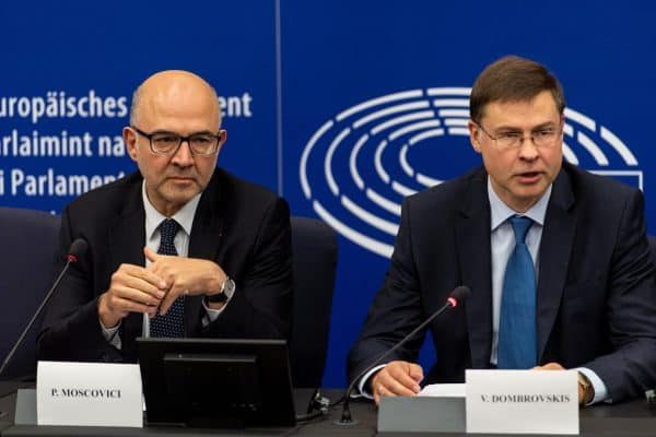 epa07113541 European Commissioner for Economic and Financial Affairs Pierre Moscovici (L) and  Valdis Dombrovskis (R), vice president of the European commission for the Euro and Social Dialogue  speaks to journalists in a press conference at the European Parliament in Strasbourg, France, 23 October 2018. The EU Commission has rejected Italy's budget for 2019 in a historic process.  EPA/PATRICK SEEGER