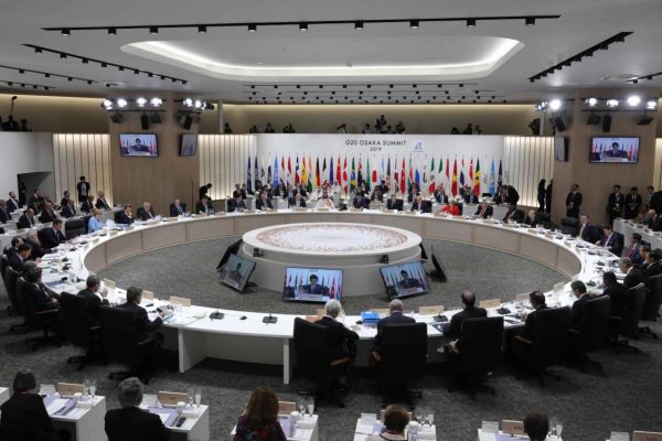 epa07679269 Japanese Prime Minister Shinzo Abe speaks while other leaders listen during a working lunch on the first day of the G20 summit in Osaka, Japan, 28 June 2019. It is the first time that Japan hosts a G20 summit. The summit gathers leaders from 19 countries and the European Union to discuss topics such as global economy, trade and investment, innovation and employment.  EPA/MICHAEL KLIMENTYEV/SPUTNIK/KREMLIN / POOL MANDATORY CREDIT