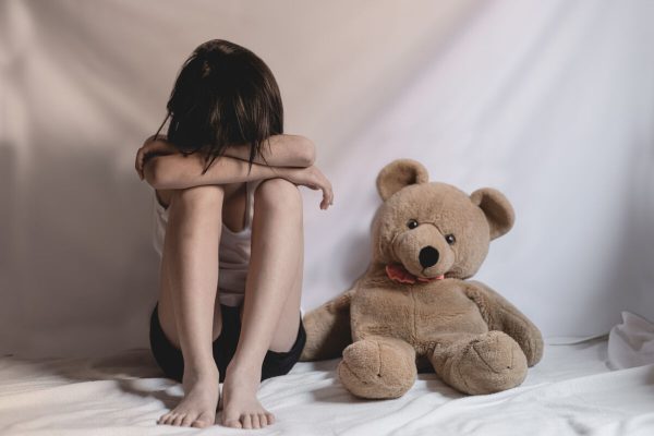 Sad,Little,Girl,Sitting,In,Room.,Human,Trafficking,Concept.